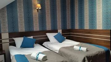 Фото номера Двухместный номер с 2 отдельными кроватями Отель Hotel Impressa г. Niedrzwica Duża 5